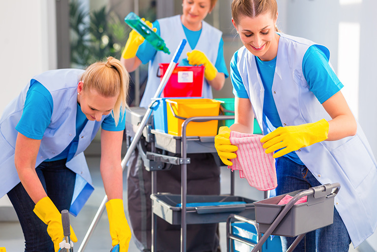 Professional cleaning staff supporting facility bathroom maintenance